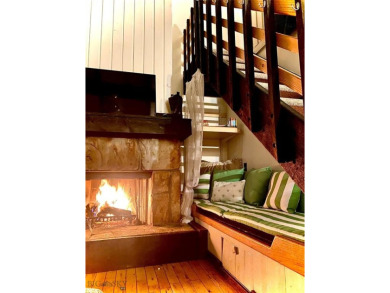 Charming and well-maintained end-unit condo featuring a cozy on Big Sky of Montana Golf Course in Montana - for sale on GolfHomes.com, golf home, golf lot