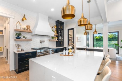 Welcome to this stylish executive home located on a 1+ acre lot on Ruggles Ferry Golf Club in Tennessee - for sale on GolfHomes.com, golf home, golf lot