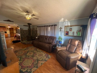 This home has three bedrooms, two bathrooms, a family room and a on The Club at Copper Valley Golf Course in California - for sale on GolfHomes.com, golf home, golf lot