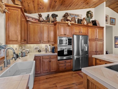 This beautifully furnished home, perfect for immediate enjoyment on Whitehawk Ranch Golf Club in California - for sale on GolfHomes.com, golf home, golf lot