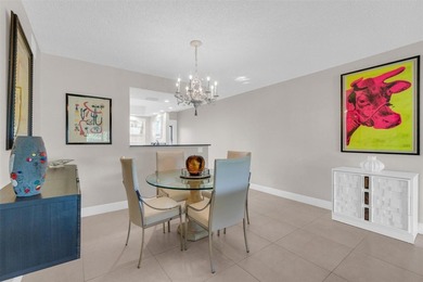 Discover this beautifully remodeled residence where elegance on Wynmoor Golf Course in Florida - for sale on GolfHomes.com, golf home, golf lot