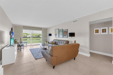 Discover this beautifully remodeled residence where elegance on Wynmoor Golf Course in Florida - for sale on GolfHomes.com, golf home, golf lot