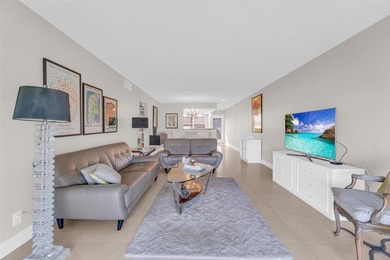 Discover this beautifully remodeled residence where elegance on Wynmoor Golf Course in Florida - for sale on GolfHomes.com, golf home, golf lot