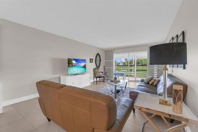 Discover this beautifully remodeled residence where elegance on Wynmoor Golf Course in Florida - for sale on GolfHomes.com, golf home, golf lot