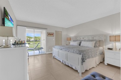 Discover this beautifully remodeled residence where elegance on Wynmoor Golf Course in Florida - for sale on GolfHomes.com, golf home, golf lot