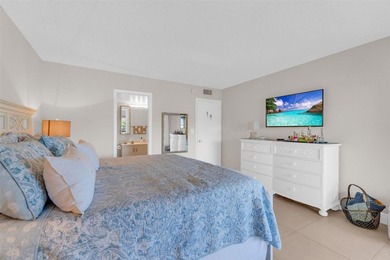 Discover this beautifully remodeled residence where elegance on Wynmoor Golf Course in Florida - for sale on GolfHomes.com, golf home, golf lot