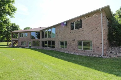 Immerse yourself in stunning river views from the large windows on Spencer Golf and Country Club in Iowa - for sale on GolfHomes.com, golf home, golf lot