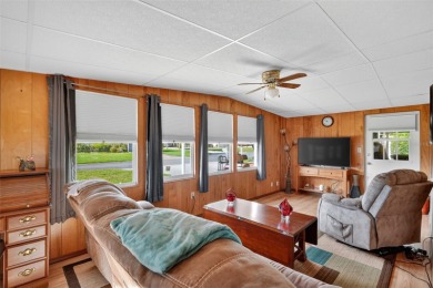 THIS CHARMING 2-bedroom, 2-bath mobile home is nestled in the on Bay Tree Golf Course in Florida - for sale on GolfHomes.com, golf home, golf lot