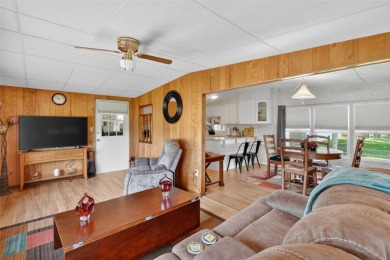 THIS CHARMING 2-bedroom, 2-bath mobile home is nestled in the on Bay Tree Golf Course in Florida - for sale on GolfHomes.com, golf home, golf lot