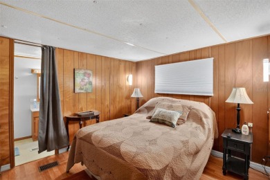 THIS CHARMING 2-bedroom, 2-bath mobile home is nestled in the on Bay Tree Golf Course in Florida - for sale on GolfHomes.com, golf home, golf lot