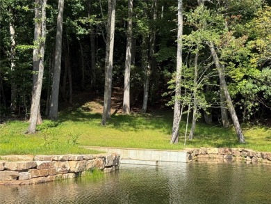 Two adjoining lake front lots on beautiful Lake Toxaway on Lake Toxaway Country Club in North Carolina - for sale on GolfHomes.com, golf home, golf lot