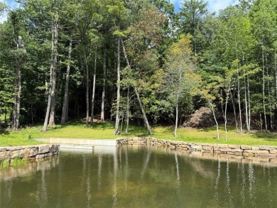 Two adjoining lake front lots on beautiful Lake Toxaway on Lake Toxaway Country Club in North Carolina - for sale on GolfHomes.com, golf home, golf lot