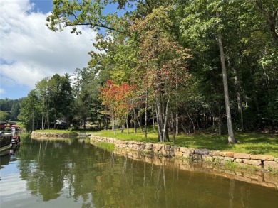 Two adjoining lake front lots on beautiful Lake Toxaway on Lake Toxaway Country Club in North Carolina - for sale on GolfHomes.com, golf home, golf lot