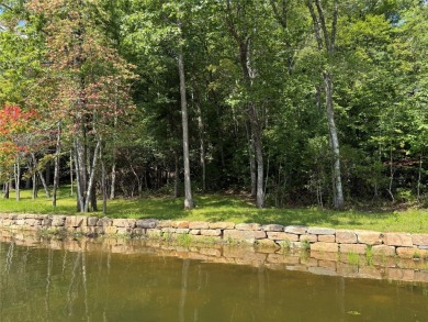 Two adjoining lake front lots on beautiful Lake Toxaway on Lake Toxaway Country Club in North Carolina - for sale on GolfHomes.com, golf home, golf lot