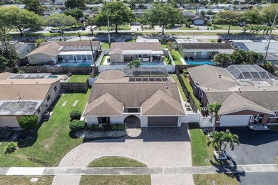 Welcome to this cozy single-family home in Sunrise Golf Village on Sunrise Lakes Phase III in Florida - for sale on GolfHomes.com, golf home, golf lot