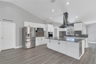 Renovated and stunning 4-bedroom, 2-bath pool home offers the on Royal St. Cloud Golf Links in Florida - for sale on GolfHomes.com, golf home, golf lot