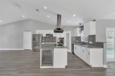 Renovated and stunning 4-bedroom, 2-bath pool home offers the on Royal St. Cloud Golf Links in Florida - for sale on GolfHomes.com, golf home, golf lot