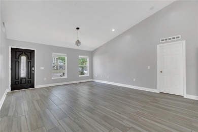 Renovated and stunning 4-bedroom, 2-bath pool home offers the on Royal St. Cloud Golf Links in Florida - for sale on GolfHomes.com, golf home, golf lot