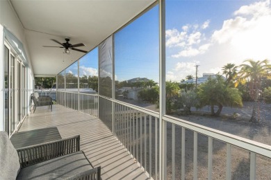 Welcome to this beautifully elevated 2-bedroom, 2-bathroom on  in Florida - for sale on GolfHomes.com, golf home, golf lot