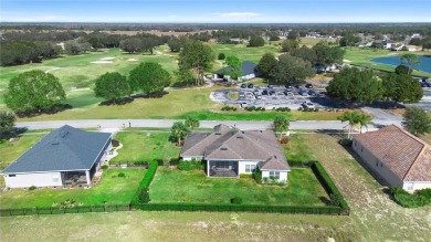 This beautifully landscaped and meticulously kept Black Bear on Black Bear Golf Club in Florida - for sale on GolfHomes.com, golf home, golf lot