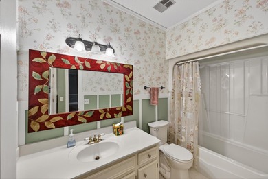 Welcome to this charming golf course home in the gated Woodside on Woodside Plantation Country Club in South Carolina - for sale on GolfHomes.com, golf home, golf lot