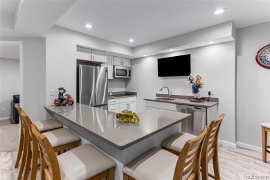 Nestled along a picturesque golf course and completely updated on Oak Pointe Country Club in Michigan - for sale on GolfHomes.com, golf home, golf lot