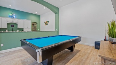 Welcome to a one-of-a-kind luxury estate in a gated Osage Beach on Sycamore Creek Golf Club in Missouri - for sale on GolfHomes.com, golf home, golf lot