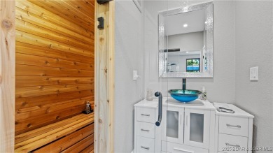 Welcome to a one-of-a-kind luxury estate in a gated Osage Beach on Sycamore Creek Golf Club in Missouri - for sale on GolfHomes.com, golf home, golf lot