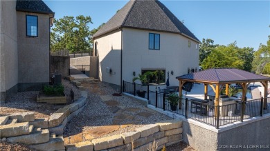 Welcome to a one-of-a-kind luxury estate in a gated Osage Beach on Sycamore Creek Golf Club in Missouri - for sale on GolfHomes.com, golf home, golf lot