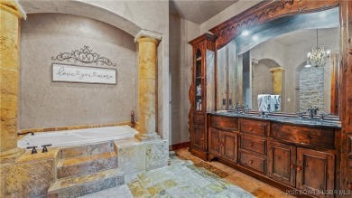 Welcome to a one-of-a-kind luxury estate in a gated Osage Beach on Sycamore Creek Golf Club in Missouri - for sale on GolfHomes.com, golf home, golf lot