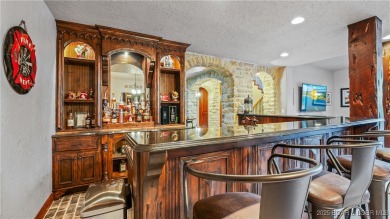 Welcome to a one-of-a-kind luxury estate in a gated Osage Beach on Sycamore Creek Golf Club in Missouri - for sale on GolfHomes.com, golf home, golf lot