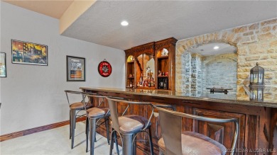 Welcome to a one-of-a-kind luxury estate in a gated Osage Beach on Sycamore Creek Golf Club in Missouri - for sale on GolfHomes.com, golf home, golf lot