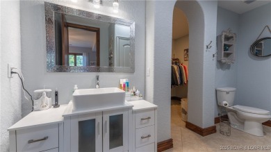 Welcome to a one-of-a-kind luxury estate in a gated Osage Beach on Sycamore Creek Golf Club in Missouri - for sale on GolfHomes.com, golf home, golf lot