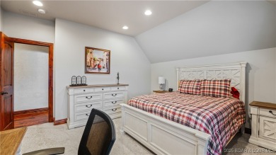 Welcome to a one-of-a-kind luxury estate in a gated Osage Beach on Sycamore Creek Golf Club in Missouri - for sale on GolfHomes.com, golf home, golf lot