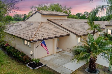 Discover this two-bedroom, two-bath end unit in Quail Meadows at on Martin Downs Country Club in Florida - for sale on GolfHomes.com, golf home, golf lot