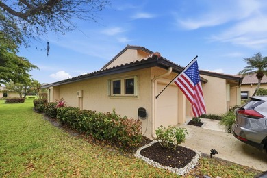 Discover this two-bedroom, two-bath end unit in Quail Meadows at on Martin Downs Country Club in Florida - for sale on GolfHomes.com, golf home, golf lot