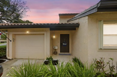 Discover this two-bedroom, two-bath end unit in Quail Meadows at on Martin Downs Country Club in Florida - for sale on GolfHomes.com, golf home, golf lot