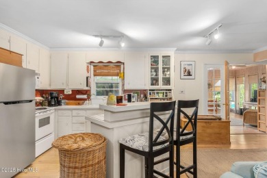 Nestled in the maritime forest of Pine Knoll Shores, this island on The Country Club of the Crystal Coast in North Carolina - for sale on GolfHomes.com, golf home, golf lot