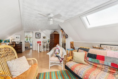 Nestled in the maritime forest of Pine Knoll Shores, this island on The Country Club of the Crystal Coast in North Carolina - for sale on GolfHomes.com, golf home, golf lot