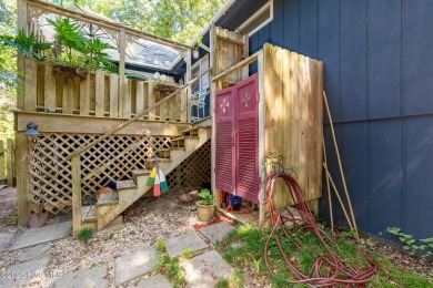 Nestled in the maritime forest of Pine Knoll Shores, this island on The Country Club of the Crystal Coast in North Carolina - for sale on GolfHomes.com, golf home, golf lot