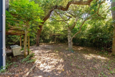 Nestled in the maritime forest of Pine Knoll Shores, this island on The Country Club of the Crystal Coast in North Carolina - for sale on GolfHomes.com, golf home, golf lot