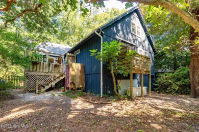 Nestled in the maritime forest of Pine Knoll Shores, this island on The Country Club of the Crystal Coast in North Carolina - for sale on GolfHomes.com, golf home, golf lot