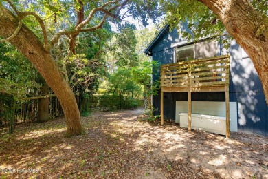 Nestled in the maritime forest of Pine Knoll Shores, this island on The Country Club of the Crystal Coast in North Carolina - for sale on GolfHomes.com, golf home, golf lot