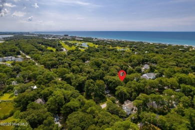 Nestled in the maritime forest of Pine Knoll Shores, this island on The Country Club of the Crystal Coast in North Carolina - for sale on GolfHomes.com, golf home, golf lot