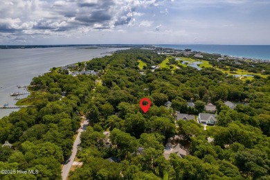 Nestled in the maritime forest of Pine Knoll Shores, this island on The Country Club of the Crystal Coast in North Carolina - for sale on GolfHomes.com, golf home, golf lot