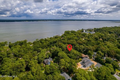 Nestled in the maritime forest of Pine Knoll Shores, this island on The Country Club of the Crystal Coast in North Carolina - for sale on GolfHomes.com, golf home, golf lot