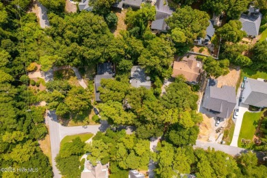 Nestled in the maritime forest of Pine Knoll Shores, this island on The Country Club of the Crystal Coast in North Carolina - for sale on GolfHomes.com, golf home, golf lot