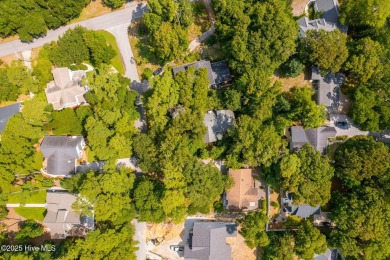 Nestled in the maritime forest of Pine Knoll Shores, this island on The Country Club of the Crystal Coast in North Carolina - for sale on GolfHomes.com, golf home, golf lot