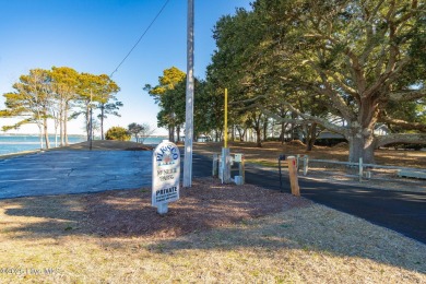 Nestled in the maritime forest of Pine Knoll Shores, this island on The Country Club of the Crystal Coast in North Carolina - for sale on GolfHomes.com, golf home, golf lot
