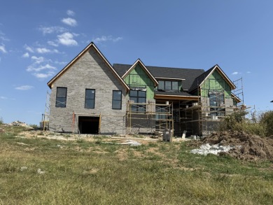 Stunning new construction located in a premier gated golf course on The Bull At Boones Trace in Kentucky - for sale on GolfHomes.com, golf home, golf lot